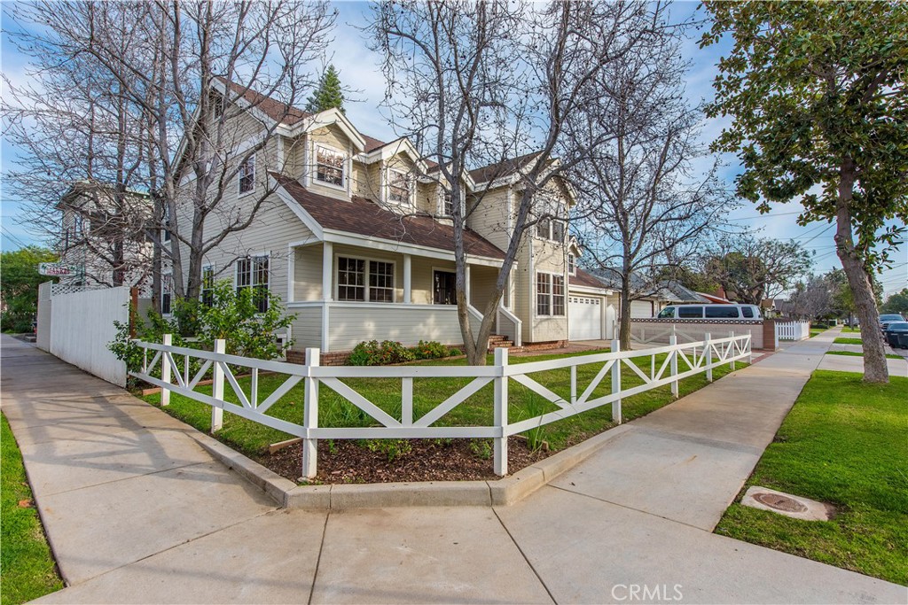 One of the newest corner lot homes in Old Towne Orange built in 1988. Walking distance to the Orange Plaza and Chapman University. This is a 4 Bed 3 Bath home that is over 2,300 sqft inside, with a large 2 car garage with a refinished floor. Outside the front door you have a comfortable refinished wood front porch looking out to Palm Ave and Cleveland St. Inside you have an open floor plan with hardwood floors and carpeted upstairs. Off the entry you have a formal dining area with a built-in china hutch, and on the other side you have a den with dual pocket doors that has been used as a 4th ground level bedroom. You also have a half bathroom located down the hall from the formal dining room. Downstairs you have a living room with a recessed media inset alongside a gas fireplace. The kitchen features stone counters ,tile backsplash, breakfast bar, built-in JennAir down draft gas stove/oven with a convection microwave, Whirlpool refrigerator, trash compactor, and dishwasher. You have direct access to the 2 car garage from the kitchen, which you’ll find newly refinished epoxy garage floor with washer, dryer, and water softener. Upstairs you have 3 bedroom, all with walk-in closets, and carpeted. The main bedroom upstairs has a tile accented gas log fireplace with a connected bathroom that has dual sinks with stone counters, seamless glass walk-in shower, and a large soaking tub. In the backyard you have 2 patio areas with a small artificial turf run on the North side of the house with a split rail fence. The home also features central air conditioning with a smart thermostat, dual option key/keyless entry, sprinkler timers, and water softener. Owner can provide home will all displayed furnishing or without.