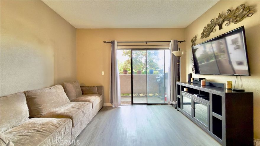 Welcome to this charming first-level condominium located in the heart of San Fernando. Set within a secure, gated community, this 2-bedroom, 2-bathroom home offers comfort, convenience, and style.

Step into a recently remodeled kitchen that’s truly a must-see—featuring custom maple cabinetry, stunning granite countertops, soft-close drawers, recessed lighting, durable tile flooring, and GE slate fingerprint-resistant appliances. Additional cabinets providing extra storage space, perfect for keeping everything organized.

The open-concept living room flows seamlessly into a small private patio, ideal for relaxing or entertaining. Living room and hallway have brand new waterproof flooring, bathroom has been tastefully updated with modern finishes to create a spa-like atmosphere.

The spacious primary bedroom includes a walk-in closet and direct access to a second small patio. Recently painted throughout the property. Other highlights include tandem two-car covered parking, a community pool and hot tub, community laundry facilities, and a recreation room.

Situated just minutes from freeways, public transportation, and local shops, this home offers both convenience and a wonderful lifestyle. Don’t miss out!