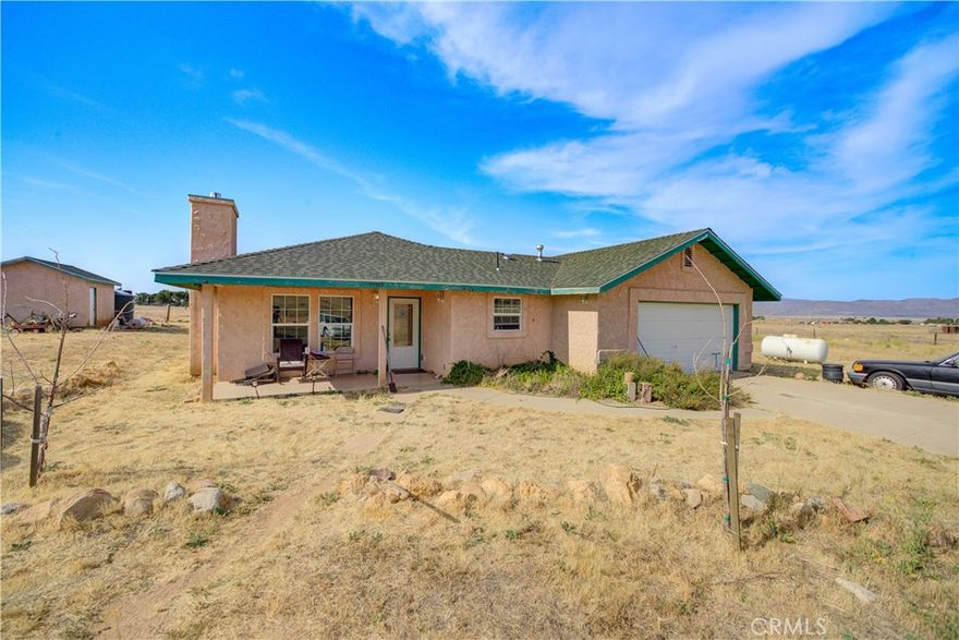 Introducing “Simmler Springs,” your private escape in Santa Margarita! Set on 2.5 acres of flat fully fenced land in the peaceful flats of Santa Margarita near Simmler, this 4-bedroom, 2-bathroom home offers 1,316 square feet of well-maintained living space—perfect for those seeking privacy, room to grow, and a slower pace of life. Whether you're a homesteader, hobby farmer, or creative spirit, this property offers endless potential. An entry gate provides both privacy and security, while the usable acreage invites gardening, keeping livestock, or simply enjoying the wide-open surroundings. Inside, the home features a warm and practical layout with generous storage in the kitchen and a striking fireplace anchoring the living area. The primary suite includes dual closets and an ensuite bathroom, while the remaining bedrooms each have their own closets and share the nearby guest bath. Out back, a versatile outbuilding provides flexible space for a workshop, studio, storage, or hangout. Additional conveniences include laundry hookups, an attached 2-car garage, and a dedicated dog run. With no close neighbors, star-filled skies, and the natural beauty of California’s coastal desert landscape surrounding you, this property offers a rare opportunity to live simply and intentionally. Located just a short drive from downtown Santa Margarita and within easy reach of San Luis Obispo, Paso Robles, and Atascadero, you'll enjoy peaceful seclusion without sacrificing access to amenities. Whether you're seeking a full-time residence, a weekend retreat, or a place to build your rural legacy, 13765 Georgia Road is ready to welcome you home.