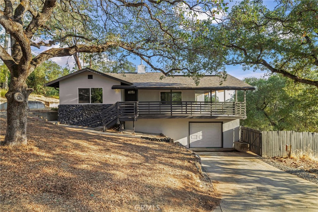 Welcome to this recently renovated 3-bedroom,2-bath home offering 1,295 sq. ft. of comfortable living space. Nestled in the foothills on a spacious half-acre lot , this property provides sweeping views of the sparkling night lights.A large wraparound deck is the perfect place to relax, entertain and soak in the scenery.The fully fenced backyard is ideal for pets, and outdoor enjoyment.Energy-efficient leased solar helps keep utility costs down.Inside, the thoughtful updates pair with an open floor plan.The location offers a secluded, private feel while being minutes from town amenities, shopping, and dining.A rare opportunity to enjoy both convenience and tranquility in one home.