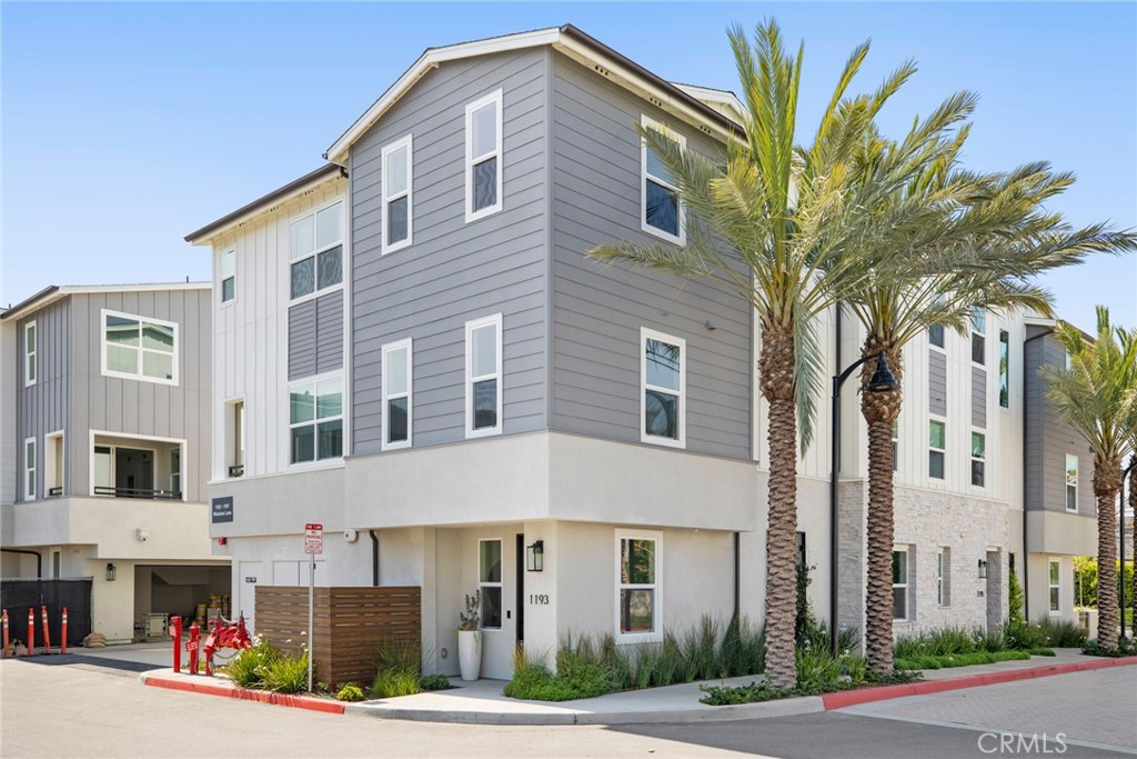 Located in a highly desirable area of Newport Beach, this impeccably designed tri-level townhome offers 4 bedrooms, 3 full bathrooms, and a bright, modern interior that’s sure to impress. Upon entry, you're welcomed by a sunlit foyer featuring a custom-built mudroom and direct access to a two-car garage complete with built-in storage. Upstairs, the second level showcases an open-concept living and dining space, a private patio, and one bedroom with an adjacent full bath—ideal for guests or a home office. The kitchen is beautifully appointed with ample cabinetry, sleek modern fixtures, a six-burner range, and stainless-steel appliances. The third level hosts three additional bedrooms and two full bathrooms, including a spacious primary suite with a walk-in closet and a luxurious en-suite bath. A conveniently located washer and dryer complete the upper level. Community amenities include a resort-style pool area with covered cabanas and built-in BBQs—perfect for enjoying the Southern California lifestyle. This townhome is ideally situated within walking distance to top shopping and dining, and just minutes from the beach and major freeways.