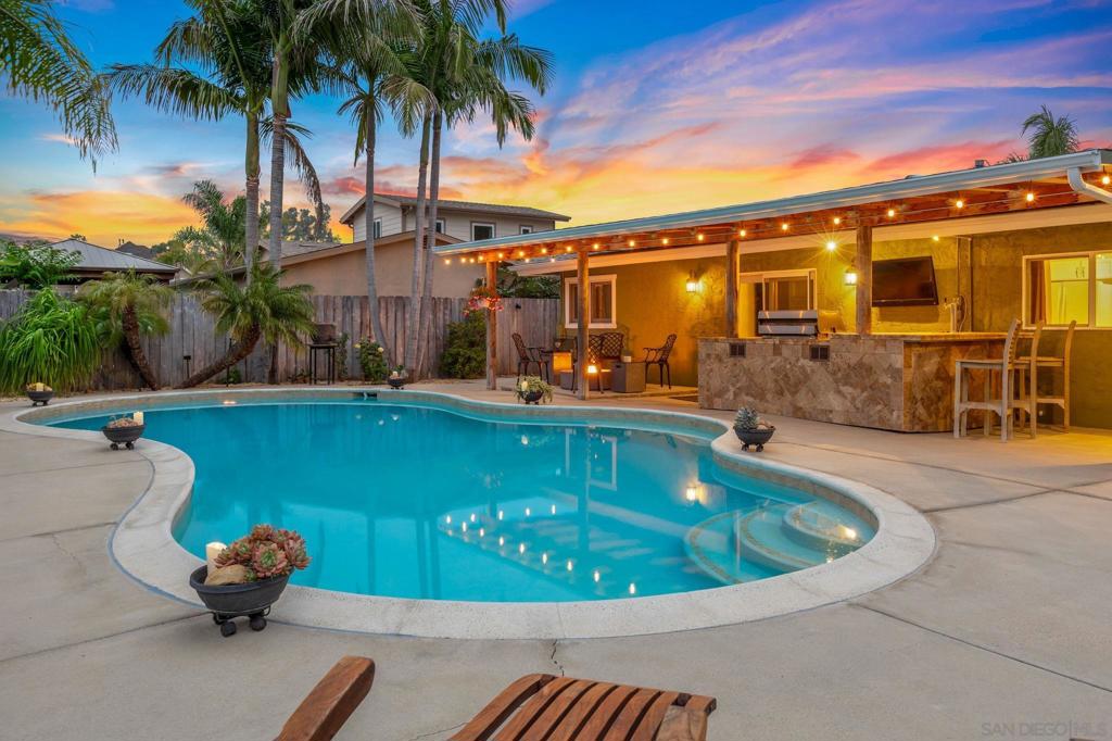 Upgraded home with spacious ADU in the heart of Poway! Just one block from Aubrey Park, Ballfields, Old Poway Park & Railroad, and the renowned Poway Farmers Market, this property offers versatility and space. Perfectly suited for multigenerational living or rental income. The property includes a main residence and a spacious attached ADU. The main home is approximately 2,000 sq ft w/an open-concept great room. The attached ADU is approximately 1,000 sq ft and offers its own private entry, dedicated parking, and a functional floor plan w/two bedrooms, two full baths, full kitchen, and direct pool access through sliding doors—ideal for home office, AirBNB, tenants, or a multigenerational family. Outside is a tropical backyard retreat featuring a heated saltwater pool, queen and king palms, birds of paradise, raised garden beds, and sundeck. A 40 ft covered patio includes outdoor kitchen area w/BBQ, bar, kegerator, and mini-fridge make this space perfect for year-round entertaining. See remarks below for more details. Upgraded home with spacious ADU in the heart of Poway! Just one block from Aubrey Park, Ballfields, Old Poway Park & Railroad, and the renowned Poway Farmers Market, this property offers versatility and space. Perfectly suited for multigenerational living or rental income. The property includes a main residence and a spacious attached ADU. The main home is approximately 2,000 sq ft w/an open-concept great room. The kitchen showcases stainless steel appliances, travertine flooring, custom cabinetry, and Brazilian granite countertops. A generous covered patio opens to a private, vinyl fenced backyard complete with turf, palm trees, and easy access to the pool. Upstairs includes a primary suite with a massive bedroom, walk-in closet, and custom shower with multiple shower heads. Another bedroom and full bath sit on the second level with a flexible loft space that can serve as a fifth bedroom/home office/media room. The finished two-car garage boasts epoxy flooring, a wall-mounted HVAC unit, air compressor, lift winch, and ample storage. The oversized driveway accommodates up to five vehicles, and provides pool and backyard access. The attached ADU is approximately 1,000 sq ft and offers its own private entry, dedicated parking, and a functional floor plan w/two bedrooms, two full baths, full kitchen, and direct pool access through sliding doors—ideal for home office, AirBNB, tenants, or a multigenerational family. Outside is a tropical backyard retreat featuring a heated saltwater pool, queen and king palms, birds of paradise, raised garden beds, and sundeck. A 40 ft covered patio includes outdoor kitchen area w/BBQ, bar, kegerator, and mini-fridge make this space perfect for year-round entertaining.