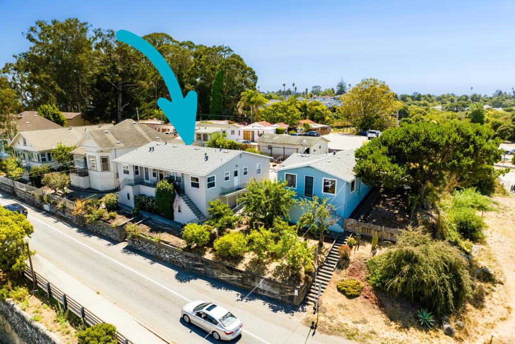 Duplex off W Cliff Dr across from Beach Hill, peaks of ocean from front porch. Each side has 2 beds and 1 bath. Updated with double paned windows, newer roof and exterior paint. Prime location near the Wharf, Boardwalk, Downtown and West Cliff Drive. Single family home (102 W Cliff) and vacant lot next door are available and can be sold separately. Buy all 3 and own your own piece of Santa Cruz! Do not disturb occupants.