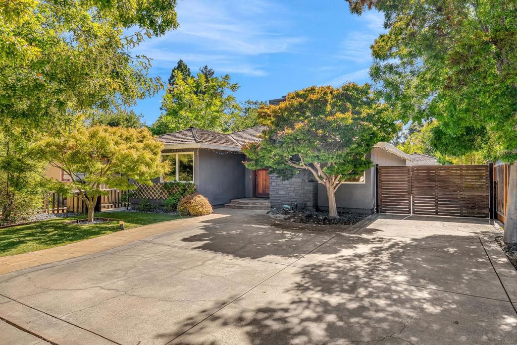 Fantastic opportunity to own this gorgeous single-family home on one of Menlo Parks most desirable streets, located within top-rated schools. This property offers a total of 1,950 sq.ft. of living space, including a 1,575 sq.ft. main house with 3 bedrooms and 2 bathrooms, plus a 375 sq.ft. detached cottage with the 4th bedroom, 3rd bath, office, and one-car garage perfect for guests or extended stays. An additional 362 sq.ft. finished attic provides versatile bonus space and features a built-in climbing wall in the second bedroom. The inviting floor plan showcases seamless indoor-outdoor living with Breezy living areas offer designer finishes and incredible conveniences. Gourmet kitchen with custom cabinets, built-in appliances. Spacious master bath with separate stall shower, and tub. Two additional bedrooms connected with jack and jill bathroom. Multiple skylights. Professional landscaping, artificial turf, built-in BBQ with sink, pergola, outdoor TV, and a charming playhouse. Long gated driveway can park multiple cars. Tesla wall connector. This beautiful home invites you to settle in and enjoy nearby parks, restaurants, shopping, all amenities and easy access to freeway, high tech companies, and the best recreation and entertainment venues in the area! Enjoy your new home!