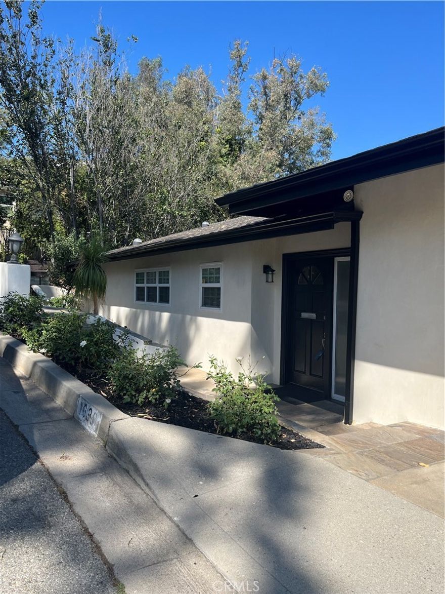 This unique one-of-a-kind home is built into the hillside of this prestigious alcove of dynamic homes.  Highly desireable area in Glendale, close to transportation to the downtown area and other popular attractions.  This home boost of light with two floors open to the rear gardens by a full wall of slider doors.  The wrap around balcony provides you with outdoor access to enjoy the beautiful grounds and serves as a solid cover for the patio below.  This home has four bedrooms, a large family room, formal living room, formal dining room and remodeled gourmet kitchen.  The kitchen is large with a nice eating area with lots of windows.  The kitchen is just remodeled to include new cabinetry, stainless steel sinks and appliances.  The views from all rooms lets in the beauty of the surrounding area.  Separate laundry room to include, washer and dryer, 3 full baths and a 2 car garage.  The grounds are sprawling and provides a tranquil setting to enjoy the outdoors.