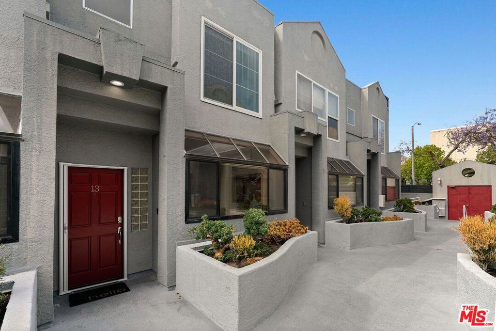 Welcome to this meticulously updated 2 Bedroom + Den & 2.5 Bathroom townhome nestled in the heart of prime Santa Monica. This exquisite residence provides ample space and luxurious comfort. The gourmet kitchen is a chef's dream, featuring stunning granite countertops, sleek stainless steel appliances, a wine fridge, and a convenient breakfast bar. It seamlessly flows into a large living and dining area, where a cozy fireplace invites relaxation and entertainment. Step outside to a private, enclosed patio area, perfect for alfresco dining and enjoying the California sunshine. Retreat to the romantic primary suite, complete with a charming balcony and spacious walk-in closet. The primary bathroom is an oasis, boasting a skylight that fills the space with natural light, dual vanities, and elegant finishes. Additional features of this remarkable home include recessed lighting, high ceilings, central heat/air and beautiful laminate plank flooring throughout. Convenience is key with in-unit laundry and side-by-side parking. Situated in a small gated and secured building, residents benefit from a well cared for building. Don't miss the opportunity to experience the best of Santa Monica living in this stunning townhome!