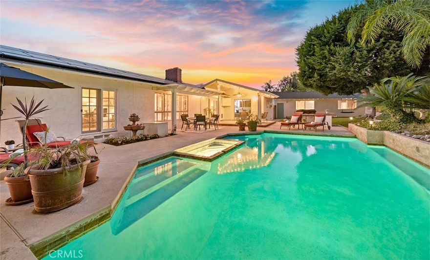 Set at the end of a peaceful cul-de-sac in one of Fullerton’s most established neighborhoods, this single-level home offers both space and serenity. Spanning 2,467 square feet on a generous 12,540-square-foot lot, the property is thoughtfully designed for comfortable living and easy entertaining. From the moment you arrive, the long private driveway and impressive six-car detached garage (943 sq ft at 39'1" x 22'5") set the tone for what’s inside. The garage offers rare flexibility, ideal for car enthusiasts, storage, or a future ADU or JADU conversion. Step inside and you’ll find a bright, open layout with four spacious bedrooms and three full bathrooms, and an office or bonus room or optional 5th bedroom just off the family room with access to the gorgeous backyard. The living areas flow naturally, with large windows framing views of the backyard and letting soft natural light fill the home. The kitchen serves as the home’s centerpiece, connecting to a casual dining space and family room where everyday life unfolds. Just outside, the backyard feels like a private retreat with a sparkling pool and spa surrounded by mature landscaping, perfect for gatherings or quiet weekends at home. Calle Ultimo (translated to "the last street") is the kind of street where neighbors look out for each other and kids play freely, a pocket of calm that feels far from the rush of city life. Fullerton is known for its strong sense of community, rich history, and safety. Local parks, golf courses, and the Famous Fullerton Loop spanning 11+ miles of walking & biking trails are close by, along with easy access to downtown Fullerton’s restaurants and coffee shops. Families appreciate the home’s location within the award-winning Fullerton Joint Union High School District, known for schools like Sunny Hills High and Parks Junior High. 2207 Calle Ultimo is more than a home. It’s a rare combination of space, privacy, and community in one of North Orange County’s most sought-after settings.