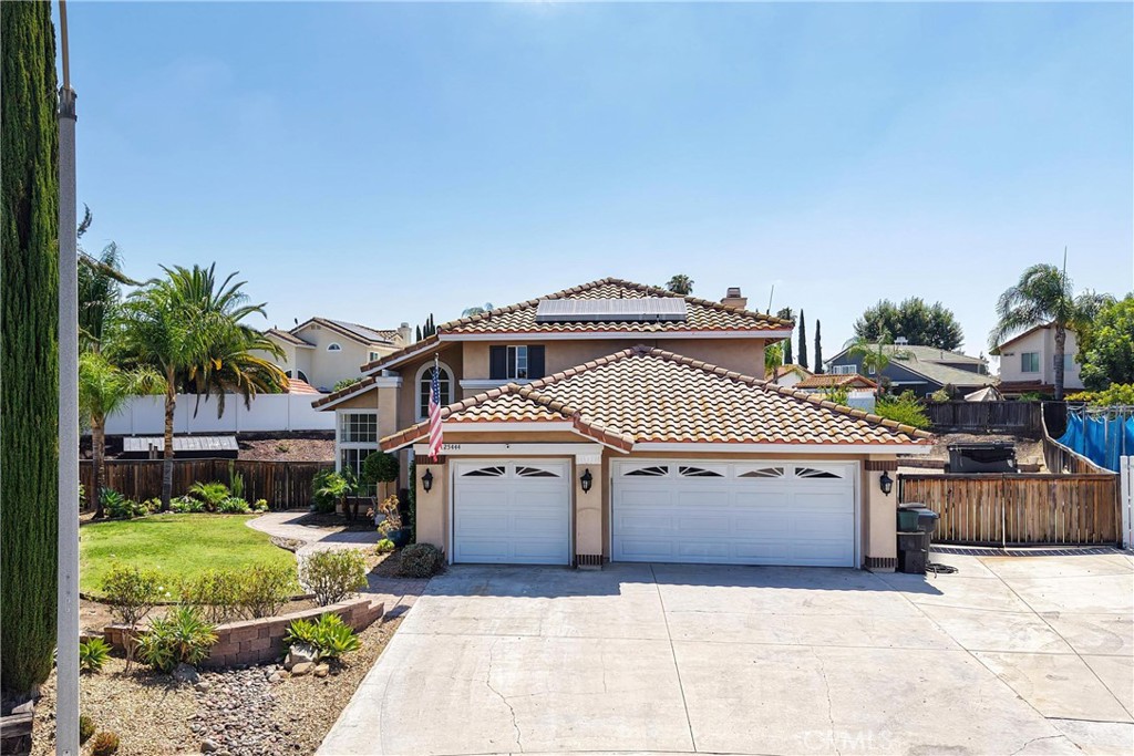 Welcome to this spacious home nestled on an expansive lot, perfect for those who crave space, functionality, and future possibilities. This home features a 3 car garage and RV parking that extends all the way to the back of the property, there's room for all your toys! The expansive lot is large enough to add a pool, ADU, or both and still have room for a garden and more. Currently there are two large raised garden beds and multiple mature fruit trees! Inside, you'll find a bright and modern updated kitchen ideal for entertaining, and brand new carpet throughout for a fresh, move-in ready feel. Three bedrooms are located upstairs and a convenient downstairs bedroom provides flexibility for guests, multi-generational living, or a home office. Don't miss this rare opportunity to own a home with room to grow in every direction!