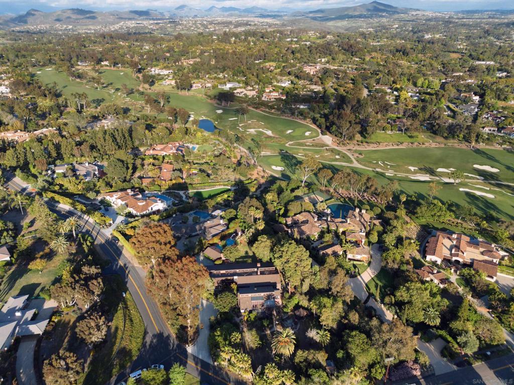 Offering a wide array of possibilities, this expansive home is a short walk to the Village, Roger Rowe School, golf course, tennis courts, and clubhouse. This property hosts three distinct structures: a 4-bed, 4-bath home (built in 1952, remodeled in 1976); a 4-bed, 4-bath structure (built in the early 1990s) is connected via a breezeway, and a separate ~900 sq ft 1-bed, 1-bath guest house adjacent to the swimming pool. Resting amidst 1.3 acres the opportunities are varied - from restoring the original home to further expansion and remodeling of the multifamily-ready site to fully capture the landscape in this perfect Rancho Santa Fe Covenant setting.