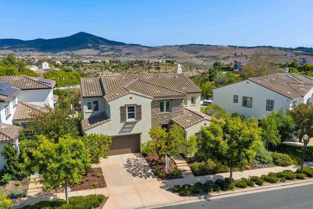 Open 11-1pm 7/23. Enjoy breathtaking mountain views from this beautifully upgraded 5bd/4.5ba home in the prestigious Presidio at Del Sur! Designed with entertaining in mind, the open-concept layout seamlessly connects the gourmet kitchen and spacious family room to an inviting backyard oasis—complete with a built-in BBQ, stand-up bar, and cozy firepit, perfect for cool evenings. Thoughtful features incl first-floor bdrm/bath, a generous loft, dedicated home office, a 3-car tandem garage w/custom cabinetry & SOLAR. Blocks from PUSD schools. Home has been freshly painted on the interior and the exterior, updated lighting throughout (incl all new LED recessed lights), new epoxy on garage floor and new carpeting on stairs and 2nd floor. Whole house water softener and water filtration system. Located in the Award Winning Poway Unified School District. Del Sur is a vibrant San Diego master-planned community where the homes and parks were inspired by historic San Diego neighborhoods. Del Sur boasts 18 miles of shared trails, 11 solar heated pools within the community's 14 parks, and is close to shopping, restaurants, & professional services in Del Sur Town Center. This home is ideally located just blocks from top-rated PUSD schools.