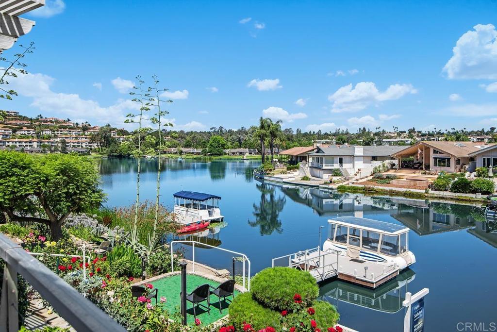 Waterfront beauty with Panoramic VIEWS & Private Dock! Welcome to the ultimate resort-style living at Lake San Marcos. This meticulously maintained single-level residence sits on an oversized 7,200 SF lot, and offers breathtaking views from expansive windows that fill the home with natural light. New updated Kitchen and bathrooms! This home offers three bedrooms plus optional bedroom currently used as an office. Paid solar system, new flooring and a large below grade storage room. Garage space for 2 cars plus golf cart. Easy access to amenities including pool, pickleball/tennis, billiard room, restaurants, golf course and more for the ultimate resort lifestyle!