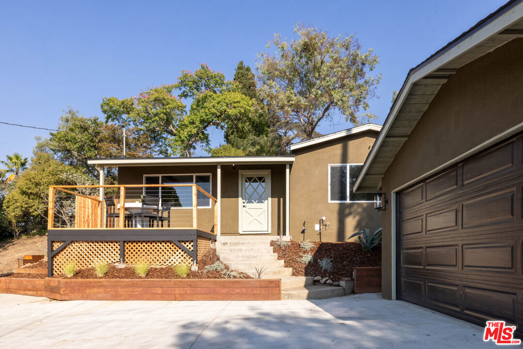 Retire to your own private retreat, high above the street, and away from it all, yet just a hop, skip, and a jump from the beating heart of Highland Park. EL RETIRO is a fully redesigned and newly expanded Modern California Ranch, perched on top of a knoll and blending beautifully into the hillside, graced with truly spectacular sunset views. This peaceful refuge offers the best of both worlds: an elevated and quiet escape from the hustle and bustle, while just down the street from the hottest new stretch of York Blvd, where you can find the likes of Queen's Raw Bar & Grill, Fondry, Skaf's on York, and Bagel + Slice.