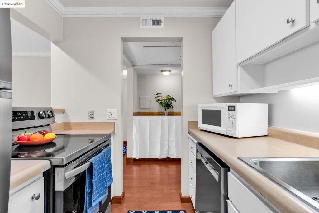 Priced to Sell! Discover this beautifully updated 1-bedroom, 1-bath condo, offering easy ground-floor access with minimal stairs. Inside, find a freshly painted interior with a newer vanity, updated living area, and kitchen. Enjoy a private balcony; this unit's right side is unattached, offering more tranquility. No maintenance needed – just move in! "The Keys" provides resort-style living in the heart of Walnut Creek. Enjoy three swimming pools (main pool heated year-round), spas, a two-story clubhouse with a gym, four lighted tennis courts, basketball, putting green, racquetball, saunas, billiard room, and BBQ areas. Directly access the Iron Horse Trail. Walk to BART, downtown Walnut Creek dining, and shops. This complex is unique for its year-round heated outdoor pool. Each building has a secured entrance and elevators (except building 480). Blocks from Highway 680, it's perfect for commuters. Laundry is on the fifth floor. Don't miss this opportunity for desirable Walnut Creek living!