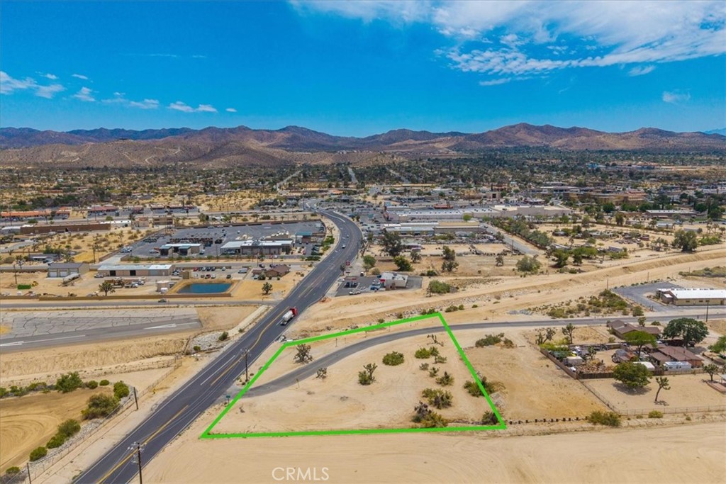 Located at the high-traffic intersection of Sunnyslope and Highway 247, this 1.7-acre parcel offers exceptional visibility and access making it a standout opportunity for your next business venture. With a dedicated left turn lane on Hwy 247 and steady daily traffic, this corner is quickly becoming one of the most sought-after spots for commercial development in the area. Whether you're looking to establish a retail space, service-based business, or long-term investment, this property is packed with potential. Don’t miss your chance to secure a premium location in a fast-growing market!