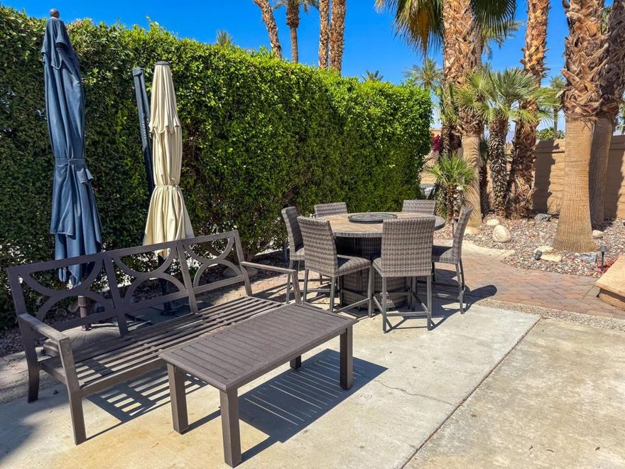 This beautiful luxury RV lot at Outdoor Resort Indio offers the perfect blend of comfort, privacy, and resort-style living. Located near the clubhouse yet tucked away against the resort entrance wall, the lot features a raised rear patio with pavers--ideal for entertaining or relaxing outdoors. Landscaping with extra palm trees and privacy hedges on both sides creates a serene, secluded atmosphere. Enjoy meals under the desert sky at a table with six chairs and two umbrellas, or fire up the BBQ for a perfect evening. The lot includes two convenient storage boxes, additional outdoor furniture, and a grassy pet area, making it both pet-friendly and practical. Whether you're looking for a personal retreat or an upscale home base for your RV lifestyle, this lot is a true gem.&#8205;Outdoor Resort Indio is a Class A only RV park.