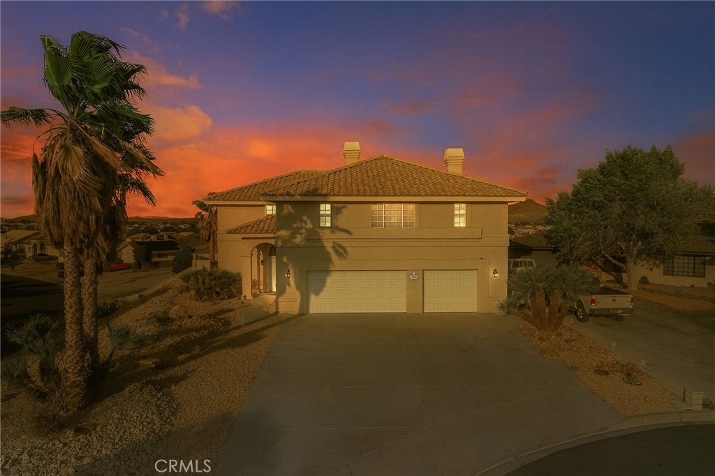 Welcome to Silver Lakes, a private resort-style community featuring a 27-hole championship golf course, two shimmering lakes, sandy beaches, and endless recreation. Nestled on a desirable corner lot in a quiet cul-de-sac, this two-story home is designed for comfort, entertaining, and breathtaking views.
Step inside to discover a versatile bonus room on the lower level complete with a wet bar, bathroom, and a small workshop—perfect for hosting, hobbies, or multi-generational living. The extra-large garage provides plenty of room for vehicles, storage, or even recreational toys.
From the foyer, choose the elevator for convenience or the grand staircase leading you to the main living area. Once upstairs, you’ll be captivated by panoramic views of the lake right from your living room and dining space. The spacious kitchen features a large center island, abundant cabinet storage, and ample counter space, making it ideal for both casual dining and preparing meals for gatherings.
The primary suite is a true retreat, offering a cozy office or sitting area, a dual-sided fireplace that warms both the bedroom and the soaking tub in the spa-like bathroom, and a huge walk-in closet with a built-in vanity. The en-suite bath is complete with dual sinks, a makeup vanity, and an abundance of space for relaxation.
Additional highlights include a large laundry room, well-planned storage throughout, and an expansive balcony overlooking the lake—the perfect spot to enjoy a morning coffee or evening sunset.
All this within Silver Lakes, where residents enjoy a lifestyle unlike any other with private parks, equestrian facilities, tennis, pickleball, and more. Whether you’re looking for a weekend getaway or a year-round retreat, this home blends luxury, function, and the natural beauty of the high desert.
Don’t miss the opportunity to make this exceptional property your own!