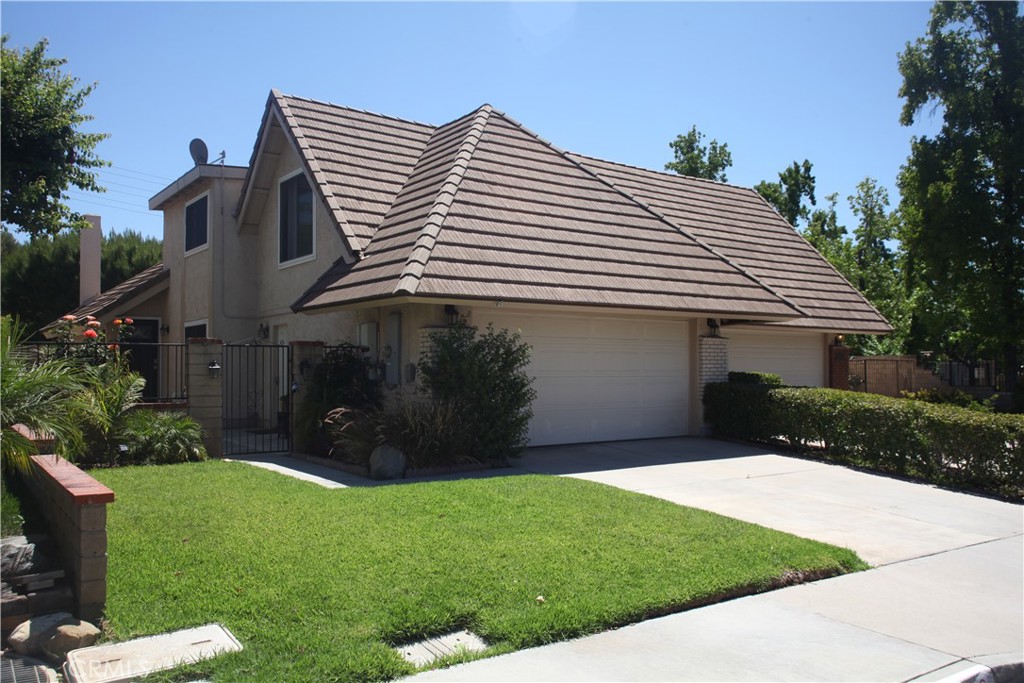 •Stunning 4-bedroom home with dual master suites, boasting approximately 2,032 square feet. Private fenced courtyard leads to the front door. Paid Solar. Welcome to this beautifully upgraded home featuring dual master bedrooms, one upstairs and one downstairs – plus three bathrooms for maximum comfort and flexibility. The modern kitchen has been tastefully updated with quartz countertops, added 6' island, with recessed lighting in kitchen and dining area. The spacious living room offers vaulted ceiling throughout and brick fireplace. All bathroom vanities have been remodeled for a fresh, stylish feel. Good size backyard to entertain family and friends. The Valencia Racquet Club is conveniently located on the North side of Santa Clarita. You will love the resort setting which includes swimming pool, hot tub, tennis courts, park and basketball courts. Served by the William Hart School District, close to shopping area, this home offers an unbeatable combination of comfort, convenience, and community