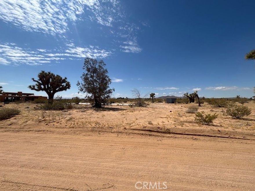 Escape to the peaceful high desert with this prime 5-acre lot near iconic Goat Mountain in Landers, California. Perfectly situated for your dream home, desert retreat, or investment property! The property features- Paid water meter already installed – a rare and valuable upgrade saving you time and money, Concrete septic tank installed – another huge step toward building made easy,  Power nearby for easy connection. Just minutes from Goat Mountain, Integratron, and Joshua Tree National Park. Whether you're looking to build now or hold as an investment, this lot offers privacy, convenience, and incredible natural beauty. Enjoy breathtaking sunsets, starry skies, and the freedom of off-grid or modern living. Adjoin APN# 0630-211-71-0000 available. Drive by!