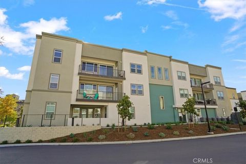 Photo of 27410 N Merlin Pl #205, Valencia, CA 91381 (MLS # SR26017263)
