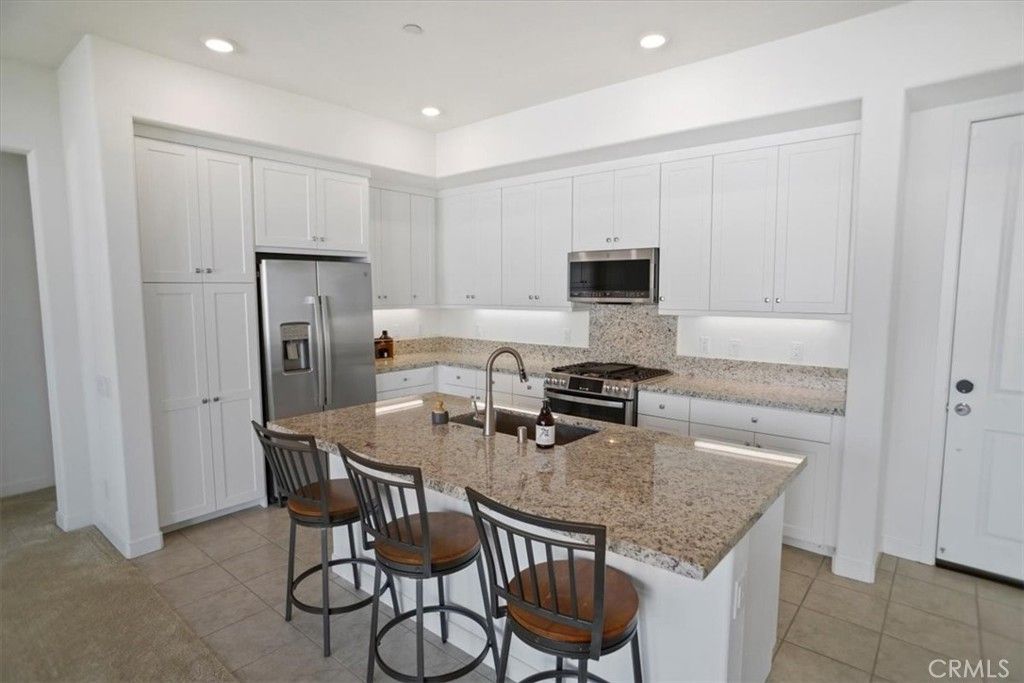 Photo of 27410 N Merlin Pl #205, Valencia, CA 91381 (MLS # SR26017263)