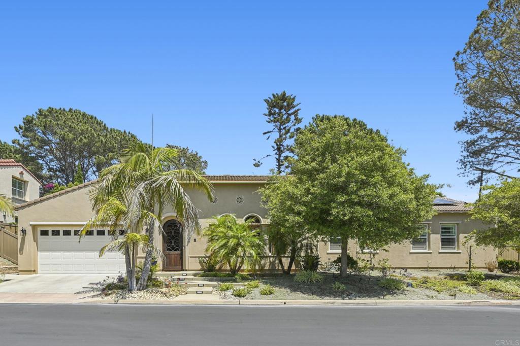 Nestled in one of Encinitas’ most coveted neighborhoods, this rare single-level gem seamlessly blends coastal elegance with spanish charm. Built in 2011, the thoughtfully designed 2,986 sq. ft. floor plan features four generously sized bedrooms, three and a half baths, and an airy open-concept layout perfect for stylish entertaining and effortless day-to-day living. At the heart of the home, a showstopping chef’s kitchen awaits—equipped with premium KitchenAid appliances, a large center island, and custom cabinetry. Designed for both beauty and function, it flows effortlessly into the sun-drenched dining and living areas, creating a warm and inviting ambiance. The expansive primary suite offers a tranquil retreat, complete with a spa-inspired ensuite bath and a spacious walk-in closet. Step outside to an inviting indoor-outdoor living area featuring a cozy fireplace—an ideal spot for year-round relaxation and gatherings. Situated on a professionally landscaped quarter-acre lot, the outdoor space is as practical as it is picturesque, with low-maintenance greenery, ample room for entertaining, and potential for a future pool. Thoughtfully upgraded with sustainability in mind, the home includes 16 owned solar panels, a garage EV charging station, dual-zone heating and cooling, and fire sprinklers throughout. A two-car garage and additional parking enhance convenience, while the prime location places you just minutes from top-rated schools, scenic parks, lively shopping and dining, and the iconic beaches of Encinitas. This is Southern California living at its finest.