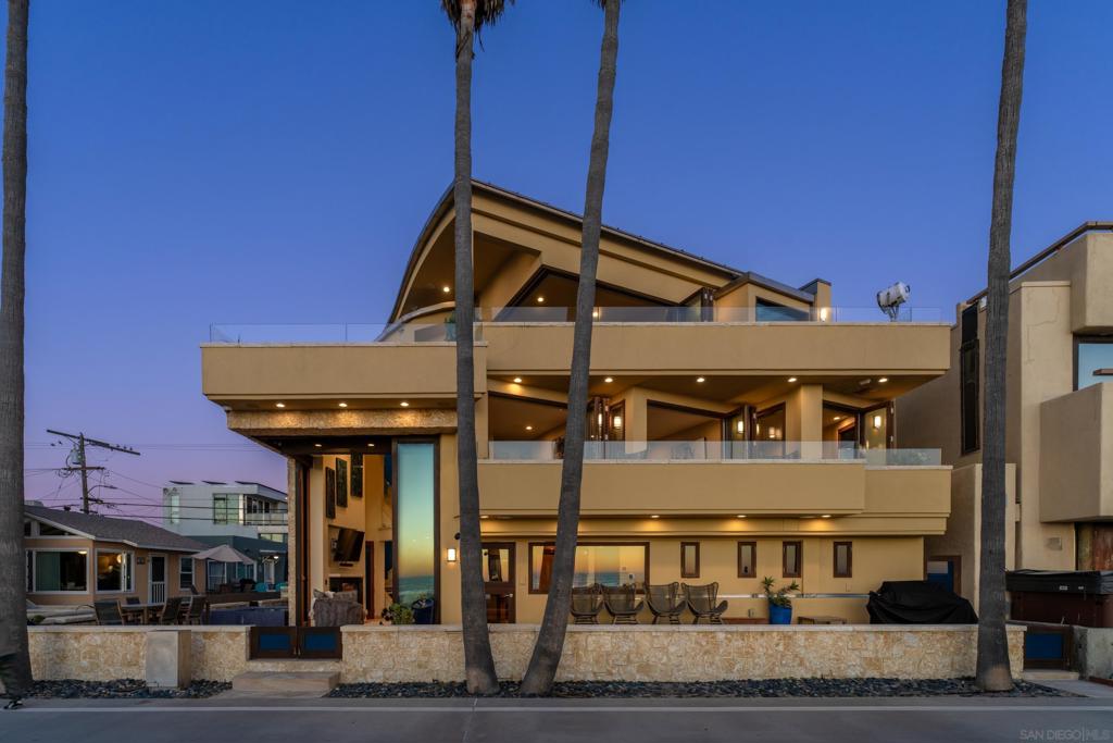 Welcome to this rarely available highly coveted North Mission Beachfront property.  This rare coastal gem sits on a coveted corner lot with an expansive 60-Foot Frontage, offering breathtaking panoramic ocean views on the Sand.   Spanning 2,354 sq. ft., this residence features 4 bedrooms and 5 bathrooms, thoughtfully designed for luxury living and effortless entertaining.  Key Features:  Seamless Indoor-Outdoor Living: Floor to ceiling Voluminous 13' stackable glass doors a custom radius design flows throughout with curved ceilings,  open to a spacious oceanfront deck with an infinity-edge spa, perfect for enjoying sunsets over the Pacific. The exterior blends limestone veneer and smooth level 5 stucco.   Chef’s Kitchen: Custom mahogany cabinetry, fossil limestone marble and granite countertops, a copper farmhouse sink, Sub-Zero stainless steel appliances, and even a built-in acrylic fish tank create a truly one-of-a-kind culinary space.  Illuminated staircase with Glass walls leads to the Master Suite: Wake up to the waves with panoramic ocean views, floor-to-ceiling stackable doors, a private patio, and a spa-inspired bath retreat.   This is more than a home — it’s a front-row seat to North Mission Beach living, blending sophistication, comfort, and the ultimate coastal lifestyle.