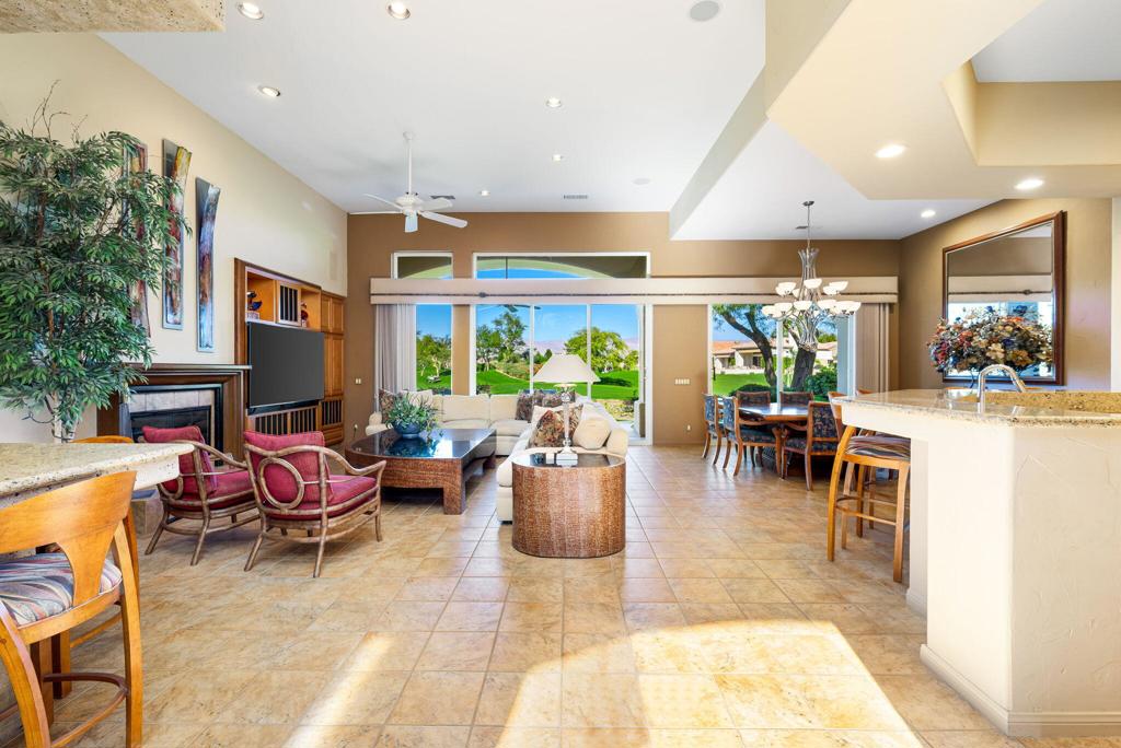 Extensive Fairway Views + Room for Pool/Casita! Bougainvillea 1 with unobstructed views of Grove #18 & the Driving Range at Indian Ridge CC. CLUB Membership available to Buyer with no wait. This 8712 sqft pie-shaped lot has possible space for a south-facing pool/spa and/or a Casita! This popular model has an open floor plan - All living & dining areas open out to the patio and share those panoramic course & mountain views. Beautifully maintained with custom details & upgrades - including: porcelain tile throughout, plantation shutters, custom interior wall finishes, newer HVAC, and more. Living room has custom fireplace mantle & entertainment center. Kitchen features upgraded wood cabinetry & appliances. Primary Suite has private access out to fairway patio - updated sinks & faucets in ensuite bathroom. Two Guest bedrooms are ensuite - 1 currently used as office. Attached 2-car garage + golf cart garage. Offered partially furnished per inventory. Solar Lease - new in 2024. Indian Ridge CC features two Arnold Palmer Signature golf courses, tennis & pickleball facilities, fitness center, full-service day spa, two restaurants, 38 community pools/spas, & active social calendar. Come join the fun! (Buyer to confirm ability to add pool/casita, including any necessary permits & authorizations.)