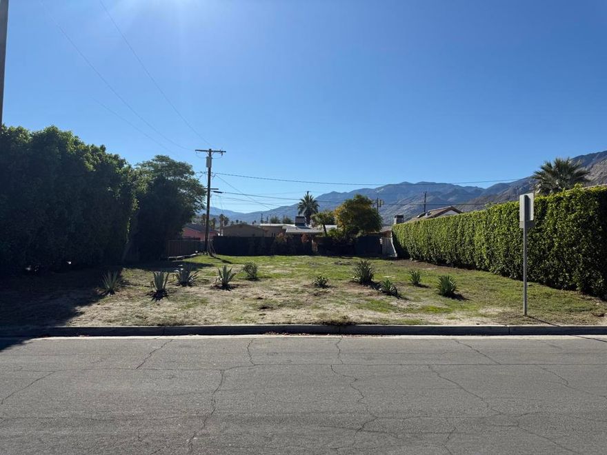 NEW YEAR'S RESOLUTION: INVEST IN LAND & BUILD YOUR DESERT DREAM HOME!  A rare opportunity to acquire a buildable, fee-simple lot in one of Palm Springs' most historic, vibrant, and walkable neighborhoods--Warm Sands. Whether your vision is a full-time residence, a private desert escape, or a vacation retreat, this exceptional parcel offers unmatched potential. Warm Sands is one of the few Palm Springs neighborhoods eligible for a SHORT-TERM RENTAL permit, currently at 5% of the city's 20% cap--an increasingly valuable advantage for investors and future homeowners. Located just one mile south of downtown and bordered by Indian Canyon Drive, the neighborhood offers effortless access to parks, boutique resorts, galleries, dining, and the best of Palm Springs nightlife. Rich in architectural character, Warm Sands features early adobe dwellings, 1920s Spanish Revival homes, mid-century modern residences, and eclectic manufactured homes--each contributing to the area's uniquely artistic charm. Known for its intimate scale and lush atmosphere, Warm Sands is also home to several small inns and destination boutique hotels that draw visitors from around the world. This vacant parcel sits on a quiet residential street and provides spectacular mountain views, a high walkability score, and close proximity to downtown amenities and the San Jacinto Mountains. The lot is flat, usable, and development-ready, with curb/gutter in place and utilities appearing to be available at the street (buyer to verify). Zoned R-2, to be confirmed with the City of Palm Springs, the property allows for a range of residential configurations, including a Single-Family Residence with an Accessory Dwelling Unit (ADU), offering desirable flexibility, guest accommodations, or potential rental income. Buyers should consult directly with the City of Palm Springs for the most current design standards, development regulations, setbacks, and allowable uses. No surveys, soils reports, or studies have been completed. This is an exceptional infill opportunity in one of Palm Springs' most iconic neighborhoods--ideal for those ready to design, build, and invest in a thriving resort market. Buyer and buyer's agent to verify zoning, utilities, lot dimensions, and all development requirements. Lot dimensions approx. 60' frontage x 100' depth. Digital renderings included in the photos are provided for visual perspective only, illustrating potential use and design possibilities for the property.