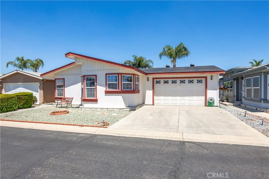 1250 N Kirby St #231, Hemet, CA – Spacious & Upgraded Home with Rare 2-Car Garage in the Foothills of Hemet 55+ Community. Welcome to this beautifully maintained 2-bedroom, 2-bathroom home located in the highly desirable Foothills of Hemet, a gated 55+ community known for its peaceful setting and resort-style amenities. This spacious home stands out with tall ceilings, an open floorplan, and upgrades throughout. The large kitchen is a standout feature, offering a center island, abundant cabinetry, and a seamless flow into the formal dining room—perfect for entertaining. The oversized living area provides ample room to relax and enjoy the natural light that fills the space. The primary bedroom suite includes a bonus area ideal for a home office, craft space, or reading nook, along with a private bath and generous closet. The secondary bedroom and full guest bath are equally well-sized, and there's a convenient indoor laundry room for added functionality. A rare find in this community: this home boasts a full 2-car garage, available only in select homes in the back section of the park. This is an incredible bonus, especially on a land-leased lot, where garages of this size are uncommon. Enjoy the outdoors from the covered front porch or unwind in the low-maintenance yard. A private storage shed is also included. All this with a low monthly space rent of just $875! Residents of the Foothills of Hemet enjoy access to a pool, spa, clubhouse, fitness center, billiards, and a vibrant calendar of social activities. Conveniently located near shopping, restaurants, medical centers, and more. Don’t miss the opportunity to own this rare gem with exceptional features in one of Hemet’s most popular senior communities!