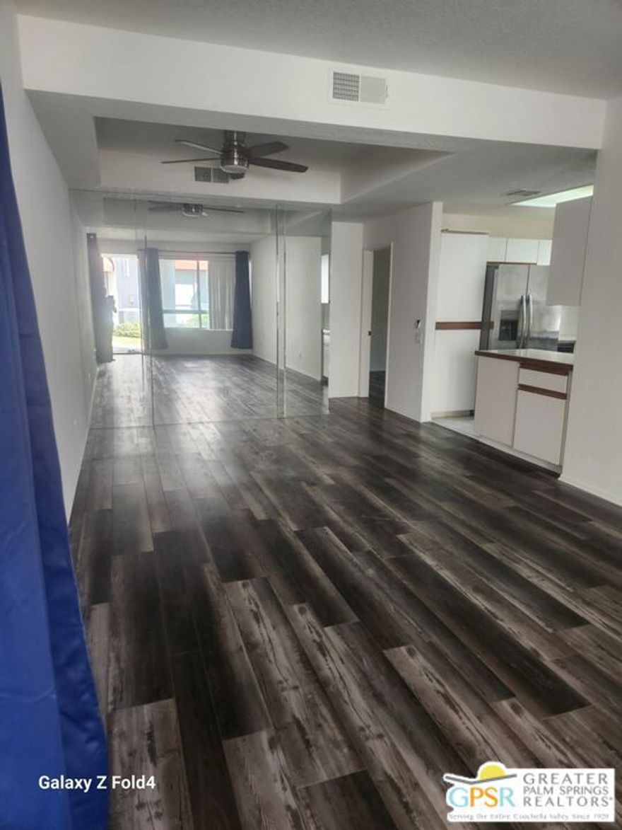 Lovely ground floor condo with ensuite bedrooms at each end.  Open floorplan. private walled patio.  Close to parking, freshly painted, vinyl plank flooring, walking distance to airport.