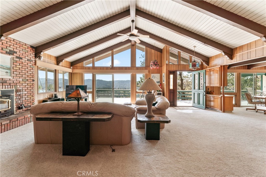This well kept mid-century home captures wide, open views of the lake and surrounding mountains. An open concept layout creates a comfortable space for gathering, while the primary suite and two additional ensuite’s offer privacy for all. The attached two car garage, parking deck, and lower parking area with RV space provide plenty of room for vehicles and guests.
Just a 10 minute walk from the lake trail off West Shore (Trail 40A), this property includes lake rights, making it an ideal base for enjoying both the water and the mountains year round.