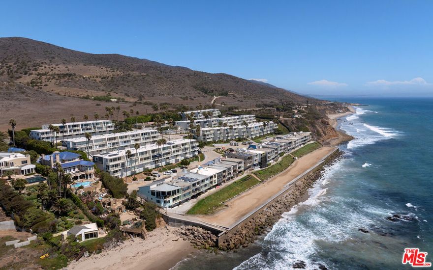 The Malibu Bay Club located on an oceanfront bluff offering an incredibly serene beach lifestyle. Known for its cove beaches and natural beauty, this property is an ocean lover's paradise, mere steps from the sand. Starfish Lane is a recently renovated 2bd/2ba unit offering endless views of the ocean and coastline towards Point Mugu rock. Single level open floor plan with high end kitchen, custom built in center island with extended counter space and seating, stainless steel appliances, dining area and a living room with walls of glass and sliding doors that open to a oceanside deck. Two bedrooms at either ends of the main hallway giving privacy for you and your visiting guests. The primary bedroom is on the oceanside with deck access and the guest bedroom looks out to the untouched mountains across the highway. The two bathrooms have been renovated and offer tastefully done finishes and fixtures. This unit is drenched in natural light! Enjoy coastline views of county line beach to the Channel Islands and you are located next to two of the local's favorite surf breaks! Private laundry room in your 2 car tandem carport plus 1 additional uncovered parking space for a total of 3 parking spaces which is unique to this unit and a few others. The Malibu Bay Club is one of only a few beachfront complexes in Malibu. Gated with secured entry, beautiful pool area with spa and direct beach access to sandy coves. The community recently completed renovations to all the condo exteriors including new roofs, copper gutters, new exterior paint, tile and more.