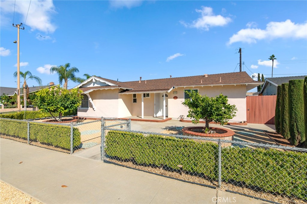 Welcome to this charming and sun-filled single-family home, ideally situated on a spacious corner lot just minutes from Chapman University!
This inviting 3-bedroom, 2-bathroom residence offers the perfect blend of comfort, functionality, and convenience. Step inside to discover a bright and cozy interior featuring central HVAC, an additional mini-split AC system, updated plumbing and electrical, whole-house soft water, and built-in surround sound in the living room. A full security camera system provides peace of mind. Outside, the property shines with abundant parking, including RV parking, and a detached garage with potential for conversion into a studio or ADU (buyer to verify). The large back yard includes mature fruit trees, drip irrigation, and plenty of space to plant flowers, vegetables, or customize your own garden retreat. Located just minutes from major freeways, shopping centers, and local dining options, this home offers an easy commute and the best of Orange County living at your doorstep. Great opportunity for investors or owner-occupants alike — don’t miss this one!