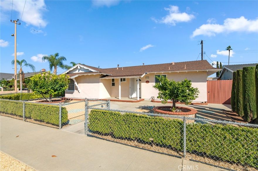 Welcome to this charming and sun-filled single-family home, ideally situated on a spacious corner lot just minutes from Chapman University!
This inviting 3-bedroom, 2-bathroom residence offers the perfect blend of comfort, functionality, and convenience. Step inside to discover a bright and cozy interior featuring central HVAC, an additional mini-split AC system, updated plumbing and electrical, whole-house soft water, and built-in surround sound in the living room. A full security camera system provides peace of mind. Outside, the property shines with abundant parking, including RV parking, and a detached garage with potential for conversion into a studio or ADU (buyer to verify). The large back yard includes mature fruit trees, drip irrigation, and plenty of space to plant flowers, vegetables, or customize your own garden retreat. Located just minutes from major freeways, shopping centers, and local dining options, this home offers an easy commute and the best of Orange County living at your doorstep. Great opportunity for investors or owner-occupants alike — don’t miss this one!