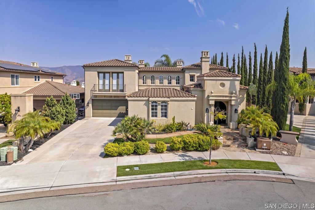 Nestled in a quiet cul-de-sac, this stunning hacienda-style residence features 5 bedrooms, 4.5 baths, a den, expansive loft, private office, wine cellar, and formal living & dining rooms. With its spacious design and timeless charm, the perfect blend of elegance and comfort. The recently renovated gourmet kitchen with oversized island, double ovens, and built-in refrigerator flows seamlessly into the expansive family room, you'll love the connection between these two spaces, perfect for gatherings and everyday living. From here, enjoy double access to the backyard and central courtyard with fireplace, one of the four fireplaces. The backyard is designed for outdoor living with a covered patio, built-in BBQ, and plenty of space to create lasting memories with family and friends. The layout includes a first-floor bedroom with 1.5 baths, while upstairs offers 3 additional bedrooms (one with balcony), a versatile den, and a luxurious master retreat with fireplace and private balcony showcasing breathtaking lake and mountain views. This Eastlake gem offers everything space, sophistication, outdoor living, and views you never want to leave!