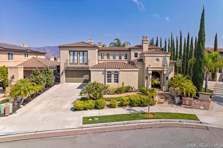 Nestled in a quiet cul-de-sac, this stunning hacienda-style residence features 5 bedrooms, 4.5 baths, a den, expansive loft, private office, wine cellar, and formal living & dining rooms. With its spacious design and timeless charm, the perfect blend of elegance and comfort. The recently renovated gourmet kitchen with oversized island, double ovens, and built-in refrigerator flows seamlessly into the expansive family room, you'll love the connection between these two spaces, perfect for gatherings and everyday living. From here, enjoy double access to the backyard and central courtyard with fireplace, one of the four fireplaces. The backyard is designed for outdoor living with a covered patio, built-in BBQ, and plenty of space to create lasting memories with family and friends. The layout includes a first-floor bedroom with 1.5 baths, while upstairs offers 3 additional bedrooms (one with balcony), a versatile den, and a luxurious master retreat with fireplace and private balcony showcasing breathtaking lake and mountain views. This Eastlake gem offers everything space, sophistication, outdoor living, and views you never want to leave!