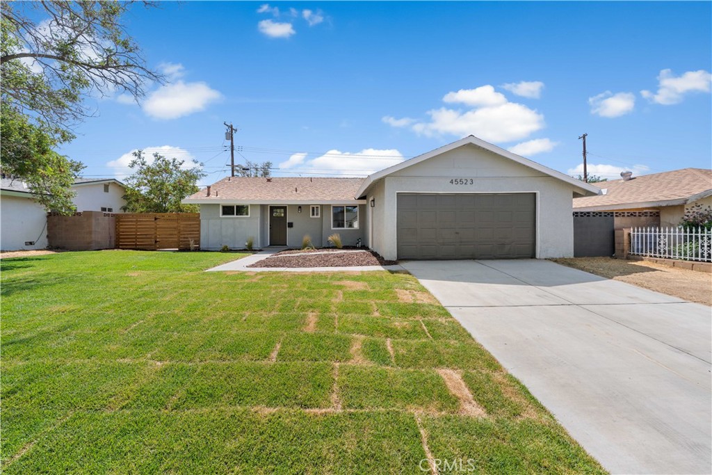 Welcome Home! This completely remodeled single story offers 4 bedrooms, 2 full baths and 1,204 square feet of living space. Great curb appeal with fresh sod and a modern paint scheme. BRAND NEW windows and central A/C unit! Large living space with recessed lighting and a sliding glass door to the backyard. The kitchen has quartz countertops, tile backsplash, NEW cabinets and stainless steel appliances. New flooring and baseboards throughout PLUS fresh interior and exterior paint. Modern bathrooms with new plumbing and electrical fixtures. Indoor laundry room and a 2 car garage. Large backyard with block wall fencing. This is truly a MUST SEE home!