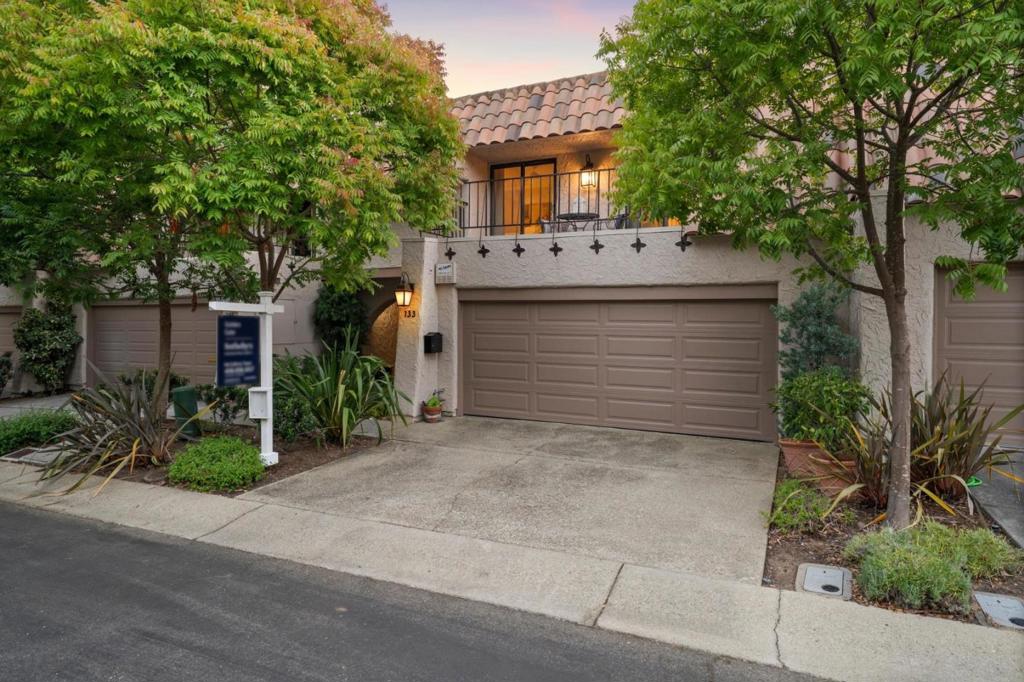 Set within the highly desirable, gated enclave of Rinconada Hills, enter a private front courtyard, framed by mature greenery and potted plantings, welcoming you into a light-filled and updated interior. Soaring ceilings and a large wall of windows fill the great room with natural light. A floor-to-ceiling stacked stone fireplace creates a striking focal point, while sliding glass doors extend the living area to a private deck perfect for morning coffee or relaxed evening gatherings. The remodeled kitchen is a true centerpiece, showcasing a large center island with seating, ample countertops, stunning backsplash, premium appliances, and crisp new cabinetry. Upstairs, the generous primary suite offers a peaceful retreat, complete with its own private balcony, a sleek fireplace, and spa-like en-suite bath featuring dual vanities and an oversized glass-enclosed shower. Two additional bedrooms, one ensuite, provide flexibility for family, guests, or a home office - one with a built-in storage wall and charming balcony access. Enjoy access to swimming pools, a spa, clubhouse with kitchen and fireplace, tennis and bocce courts, meandering walking paths, and 24/7 security, all just minutes from downtown Los Gatos and Campbell, top-rated schools, hiking trails, and major commute routes.