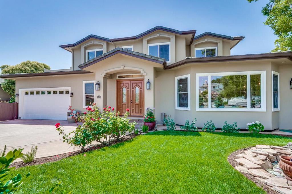 Situated in one of Silicon Valley's most prestigious neighborhoods, stunning 5 bedrooms + study + den, 5.5 bathrooms estate offers 5,220 sq ft of living area on 9,110 sq ft lot. 2 en-suite bedrooms on the main floor, ideal for guest room, home office or in-laws quarters. This home is within close proximity to academically distinguished Cupertino schools: Monta Vista High, Kennedy Middle and Lincoln Elementary. Impressive double front door leads to an inviting, spacious floor plan. The formal living room features a high ceiling with crown moldings, recessed lights, fireplace with decorative mantle, bay window showcases exterior views. The elegant dining room is adorned with 2 columns, designer's light fixture, perfect for social gathering and guest entertaining. The gourmet, chef kitchen is complete with gas stoves, center island with sink, breakfast bar, walk-in pantry, abundance of cabinetry. The luxurious primary suite features dual vanities, soaking tub, shower, walk-in closet and a private patio. The expansive lower level offers a home theatre, study ( plumbed as a laundry room ), a bathroom, and provides ample space for gathering, relaxation and play. The magnificent, serene backyard and side yard boasts a lawn area, fruit trees and patio, great for outdoor enjoyment!