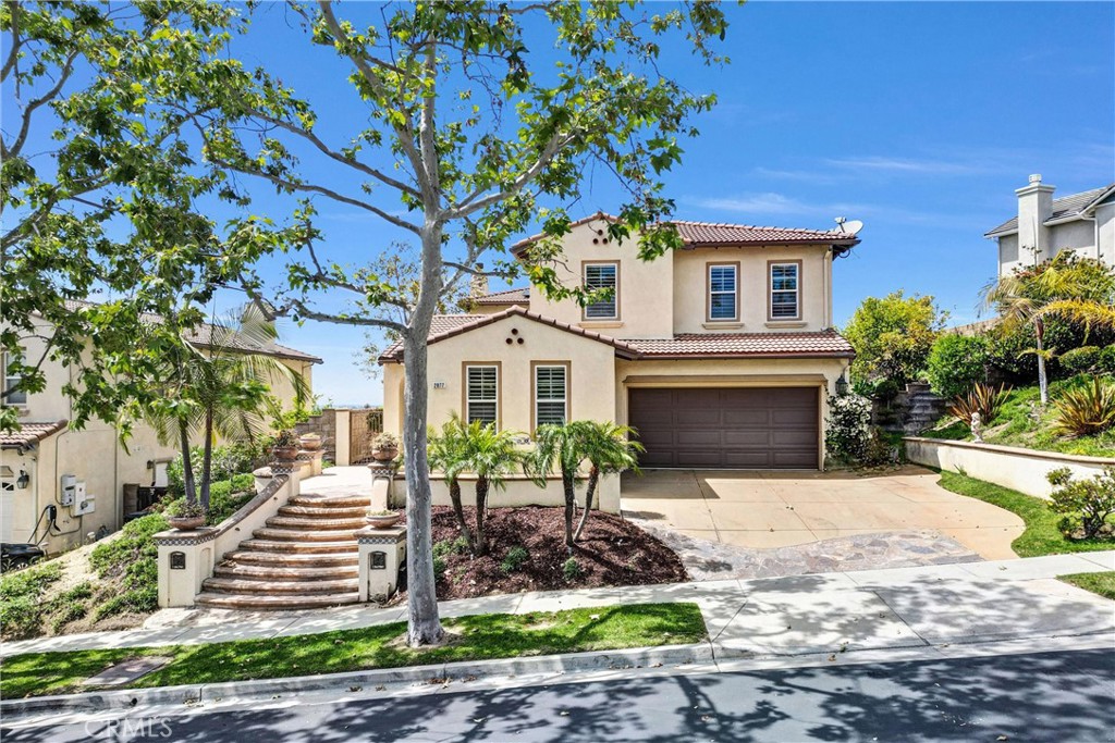 **Stunning Panoramic views of City lights, Sunset, DTLA and Santa Monica Mountains** Welcome to 2877 Muir Trail Dr. *Impressive residence located in the Prestigious 24HR Guard-gated community of Hawks Pointe. This Beautifully upgraded Home features 6 Bedrooms, including 2 Bedrooms (1 of Bedroom en-suite) on the Main floor, ideal for Multi-generational living, Guests, or a Private home office. Upstairs you’ll find 4 Additional Spacious Bedrooms, including a Luxurious Primary suite with Stunning Panoramic views, a Spa-like en-suite Bathroom, and a Large His & Hers walk-in closets with mirrored doors. Upon Entry, You’re greeted by a Formal living area with Charming private Courtyard down to the common hallways, the Formal dining room all the way through the open Family room and Gourmet kitchen. The Expanded & Upgraded Gourmet kitchen featuring Granite countertops, Stainless steel appliances, a Large center island, and plenty of cabinetry—perfect for both entertaining and everyday living.
Step into the backyard and soak in unobstructed Panoramic Views, making it an ideal setting for morning coffee, sunset dinners, or weekend gatherings. The Home also comes with fully paid-off solar panels, Tesla powerwall, providing major energy savings. Additional Highlights include wood plantation shutters throughout, Upstairs Laundry room, and Recessed lightning. Located within a well-maintained family friendly community that offers Beautiful walking and hiking trails, Hawks Pointe provides a peaceful and private atmosphere while being just minutes from everything. Enjoy easy access to the 5 and 91 freeways, and be close to Top-rated schools, shopping centers, dining destinations, several parks, Golf courses and more!! This is your chance to own a rare view home that combines Luxury, Comfort, and Convenience—All in one of Orange County’s most desirable Gated neighborhoods.