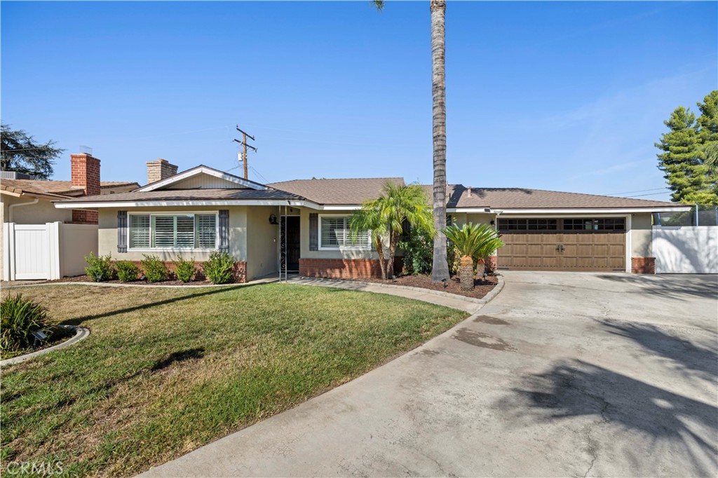 Welcome to this beautiful single-story home, ideally situated in a cul-de-sac in a peaceful upper Yucaipa neighborhood. This thoughtfully upgraded 2-bedroom, 1.5-bathroom home has spared no expense. Custom solid wood stained front entry door with speak easy welcomes you into the open and airy floor plan, where natural light pours in through energy-efficient dual-pane windows, creating a bright and welcoming atmosphere. The living room is highlighted by a classic brick fireplace and seamless laminates that flow throughout the entire home, combining style with easy maintenance. The heart of this home is the beautifully newly updated kitchen, designed for functionality. Featuring sleek white quartz countertops and custom cabinetry with soft-close drawers, this kitchen is both stylish and user-friendly. The dining area provides the perfect spot to accommodate those family holiday gatherings and is open to the kitchen and living areas. Each bedroom offers plenty of space and natural light, creating a peaceful retreat for every member of the household. The guest bathroom has been updated with modern fixtures and finishes, a jetted tub, and a separate glass panel stand-up shower, adding a fresh and polished touch. The backyard is designed for both relaxation and entertainment. A covered patio provides a shaded retreat for outdoor dining. Custom-built barn sliding closet doors throughout. Additionally, there is a double vinyl side gate to allow access for a trailer, project vehicle, or RV. The entire home has been re-piped using PEX tubing, a new water heater, a new roof, a high-efficiency A/C unit, plantation shutters on all front windows, a custom wood faux finish garage door, and, not to mention, solar will be paid off at the close of escrow with the right offer. Don’t miss out on this beauty.