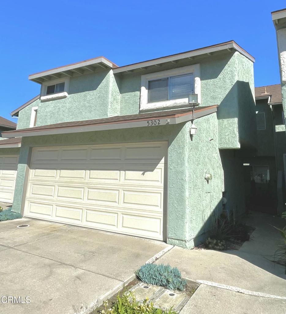 Don't miss out on this cozy two-story townhome with an open and spacious floor plan. The large living area features a vaulted ceiling, while the kitchen is updated with stainless steel appliances, making it perfect for cooking up your favorite meals. The home also boasts upgraded wood-like flooring and an indoor laundry area. Attached to the house is a two-car garage with direct access, providing ample space for your vehicles. An assigned parking spot is also included within the unit. The spacious backyard is ideal for relaxation and barbecues. Additionally, you'll appreciate the nearby community swimming pool, which offers a refreshing escape during the summer months. It's conveniently located just minutes away from the beach, naval base, and shopping. This townhome is a must-see!