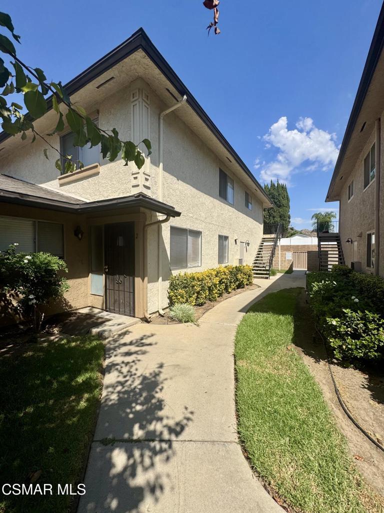 Updated 2 bedroom condo with wood-like floors & central a/c. The kitchen has granite counters, dishwasher and includes a refrigerator. The bathroom has been updated with newer vanity, mirror, and lighting. Single car shared garage & assigned parking space. Community pool and shared laundry facility. Water and trash are included. Centrally located near shopping & parks.