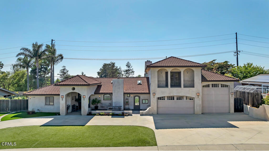 Tucked away on a quiet, flat cul-de-sac in the coveted Las Posas Estates, this spacious and versatile home offers breathtaking views and room to grow. Step through custom iron and glass double doors into a light-filled great room and dining area where natural light floods every corner. Designed for flexibility and comfort, this home features two primary suites on the main level--perfect for multigenerational living--plus a total of five bedrooms, a bonus room, and an oversized loft. Built-in desks in the great room create functional spaces for work, study, or creativity. Set on a large, flat lot, there's ample room for a boat, trailer, or toys, and even space for a future pool. The accordion-style patio doors open seamlessly to a covered outdoor living area with a fireplace, creating the ideal setting for indoor-outdoor entertaining. Upstairs, a generous deck showcases sweeping views from the Santa Monica Mountains, Point Mugu, then around to the Topa Topa mountains--spectacular sunsets await you year-round. The vaulted-ceiling game room offers space for a pool table, poker nights, and a potential wet bar. Additional highlights include a wine cellar, walk-in pantry, three fireplaces, and a 2008 addition that doubled the home's square footage, adding a new primary suite, expanding the garage, adding a new upstairs level, and reimagining the layout for modern living. The oversized 2-car garage is extra deep and tall, while the separate RV garage accommodates vehicles up to 40'. Thoughtful upgrades include laminate wood and slate-look porcelain tile flooring, a handicap-accessible second primary suite, and artificial turf for low-maintenance yards. Even the driveway offers recreation with half-court basketball lines etched in. Located near three private country clubs, just 20 minutes to the beach, and under an hour to both Santa Barbara and Los Angeles--this is Camarillo living at its finest.