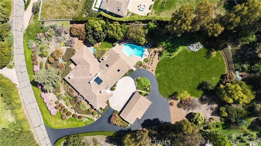 Stunning 5,100+ SF estate in an exclusive, private, guard-gated city offering stunning panoramic city, mountain and Queen’s necklace views. This extraordinary architecturally compelling home boasts high ceilings throughout, creating an airy, open atmosphere. Featuring 4 spacious bedrooms, multiple living areas, and a chef’s kitchen, three separate offices, every detail has been designed for both comfort and elegance. The property sits on 2 usable acres, with a resort-style backyard including a sparkling pool/spa, a large rolling lawn area perfect for relaxation and entertaining for that indoor/outdoor California lifestyle. A separate guest house adds privacy and versatility for visitors or additional living space. The circular driveway with motor court and an impressive 5-car garage provides ample storage and parking. This home is a rare find, combining modern amenities with breathtaking natural beauty. Don’t miss this exceptional opportunity!  The private gated city of Rolling Hills offers miles of hiking trails, community equestrian facilities, including three riding rings, and lighted tennis and pickleball courts with the utmost in security and privacy.