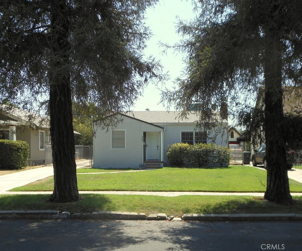This charming home is located just one block from the University of Redlands at 926 Campus Avenue #1. This home has two bedrooms, one bathroom, refinished wood floors, central A/C and heat, a large kitchen with plenty of storage, a great dining nook, and a wood burning fireplace in the living room. The many windows provide plenty of natural light. Both bedrooms have nice size closets, and extra storage is provided by the walk-in hall closet. Laundry hook-ups are located in the single car garage. The house sits on large lot with nice backyard. The back portion of the lot has an accessory dwelling unit which is leased separately.