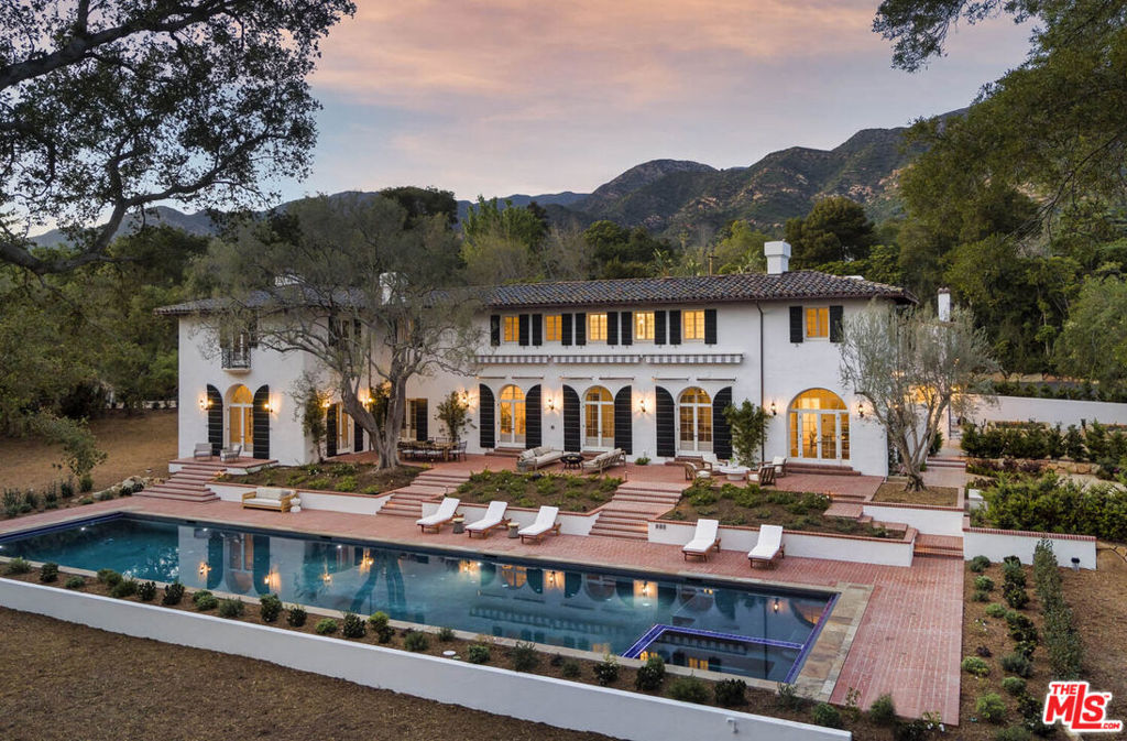 Iconic George Washington Smith and Lutah Riggs architecture, an extensive restoration, luxe modern finishes and design, and a history of Hollywood royalty coalesce at Las Armas - a beautiful 1929 Spanish colonial revival estate in the heart of Montecito's Golden Quadrangle. Beautiful southern light fills the spacious living room which doubles as a state-of-the-art theater and a secret wine cellar. The dining room is ideal for entertaining with a bar/lounge tucked away for cocktail hour. Upstairs, a gracious master suite features a private office with a fireplace. Outside, a dramatic 88' pool is perfect for lounging, splashing or napping. Effortless flow between the residence and gardens embody Montecito's elevated indoor/outdoor lifestyle.
