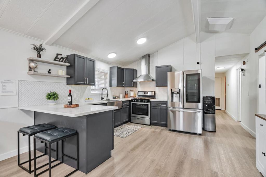 Welcome to this stunning, fully upgraded 2-bedroom + office, 2-bathroom home offering 960 sq ft of bright, modern living in the heart of Silicon Valley. With over $70K in renovations, this home is the perfect blend of style, comfort, and value. Step inside to enjoy features of a newer roof, dual-pane windows, SPC waterproof luxury flooring, quartz kitchen countertops & shaker cabinets, hallway bathrooms, mini-split heating & A/C system throughout, and so much more! Relax or entertain in the cozy private backyard, and enjoy private parking for up to 4 cars - a rare find! The community offers great amenities, including a clubhouse with a kitchen, a swimming pool, and an unbeatable location near freeways (101, 880, 680), Great Mall, shopping, and restaurants. Space rent will be just $1,259/month. Whether you're buying your first home, downsizing, or investing, this is an incredible opportunity to own an affordable, stylish home in one of San Jose's most convenient locations.