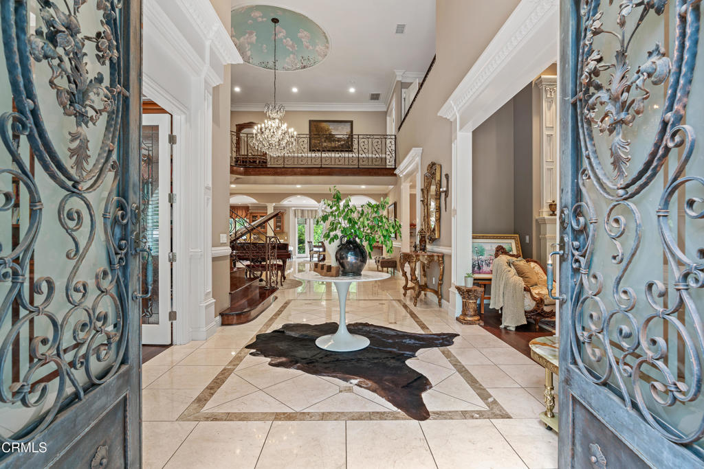 Welcome to this stunning Mediterranean luxury home nestled in the quiet and prestigious neighborhood of La Canada Flintridge. Situated in the heart of nature, this exquisite residence features 6,518 sq.ft and occupies an approx. 19,629 sq.ft lot with landscaped gardens that are truly a sight to behold.With 5 spacious rooms and 6 bathrooms, each bedroom boasting its own private bathroom, this home provides the utmost convenience for every member of your family. One of these bedrooms offers direct access to the backyard, creating a private retreat for guests or family members. The interior features are truly remarkable, with high ceilings that create an open and airy atmosphere throughout the house. The main level seamlessly flows into an open concept design, with the family room seamlessly connecting to the living room and offering direct access to the backyard a true entertainer's dream. The gourmet kitchen, a chef's delight, showcases new granite counters, top-of-the-line appliances, and an abundance of sleek cabinets. Step outside and be captivated by the enchanting Mediterranean-style exterior. Entertain guests with ease in the backyard oasis, which features a built-in BBQ, a sparkling swimming pool and spa, and a lavish waterfall. The covered patio and gazebo offer the perfect spots to relax and unwind, while the spacious backyard provides plenty of room for parties and gatherings. The lush and bushy backyard, adorned with an abundance of trees, creates a serene and private sanctuary. With a 3-car garage, this property provides ample parking space for your convenience. Award Winning La Canada School District.