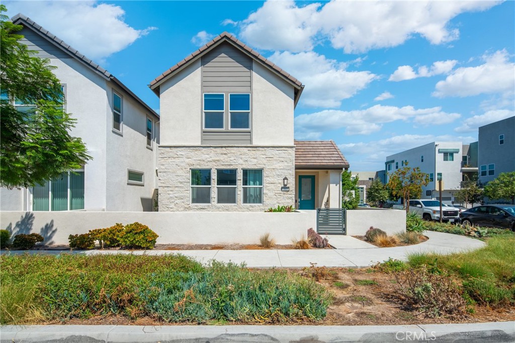 Beautiful 2022-built 4-bedroom, 3-bathroom home with 2,656 sqft of upgraded living space, situated on a rare three-side open corner lot in Solis Park, Great Park. The first floor features a full guest suite, while the upstairs includes a bright loft, a luxurious primary suite, and two additional bedrooms. This home is thoughtfully upgraded with a whole-house water softening and purification system, smart kitchen appliances, upgraded flooring, solar panels, and a Tesla charging station. Just a 5-minute walk to award-winning Portola High School and Solis Park School, and residents enjoy access to community amenities such as pools, parks, sports fields, playgrounds, and scenic trails.